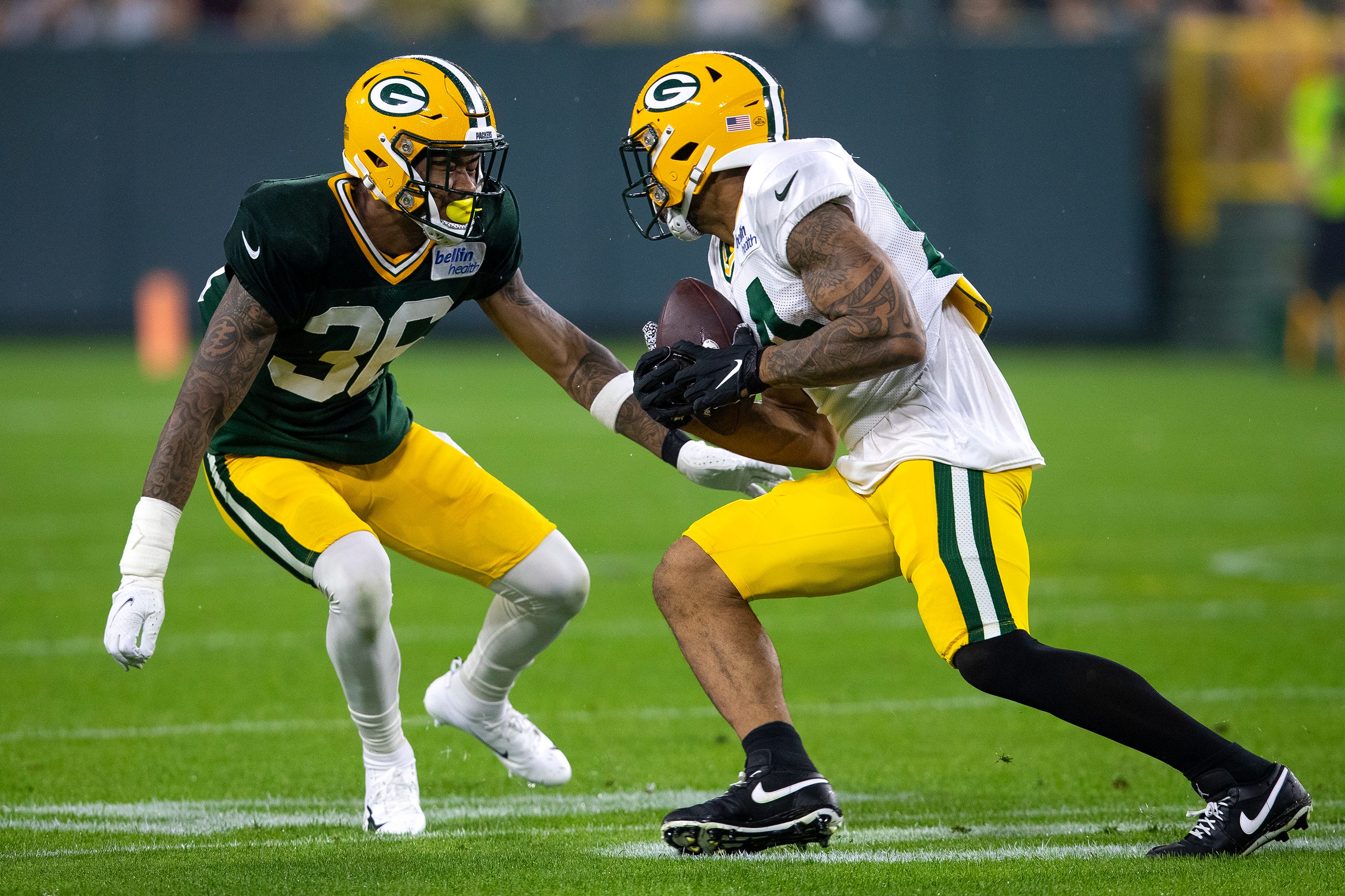 Green Bay Packers wide receiver Reggie Begelton (84) runs the ball against defensive back Vernon Scott (36) during Packers Family Night at Lambeau Field, Saturday, Aug. 7, 2021, in Green Bay, Wis. Samantha Madar/USA TODAY NETWORK-Wisconsin