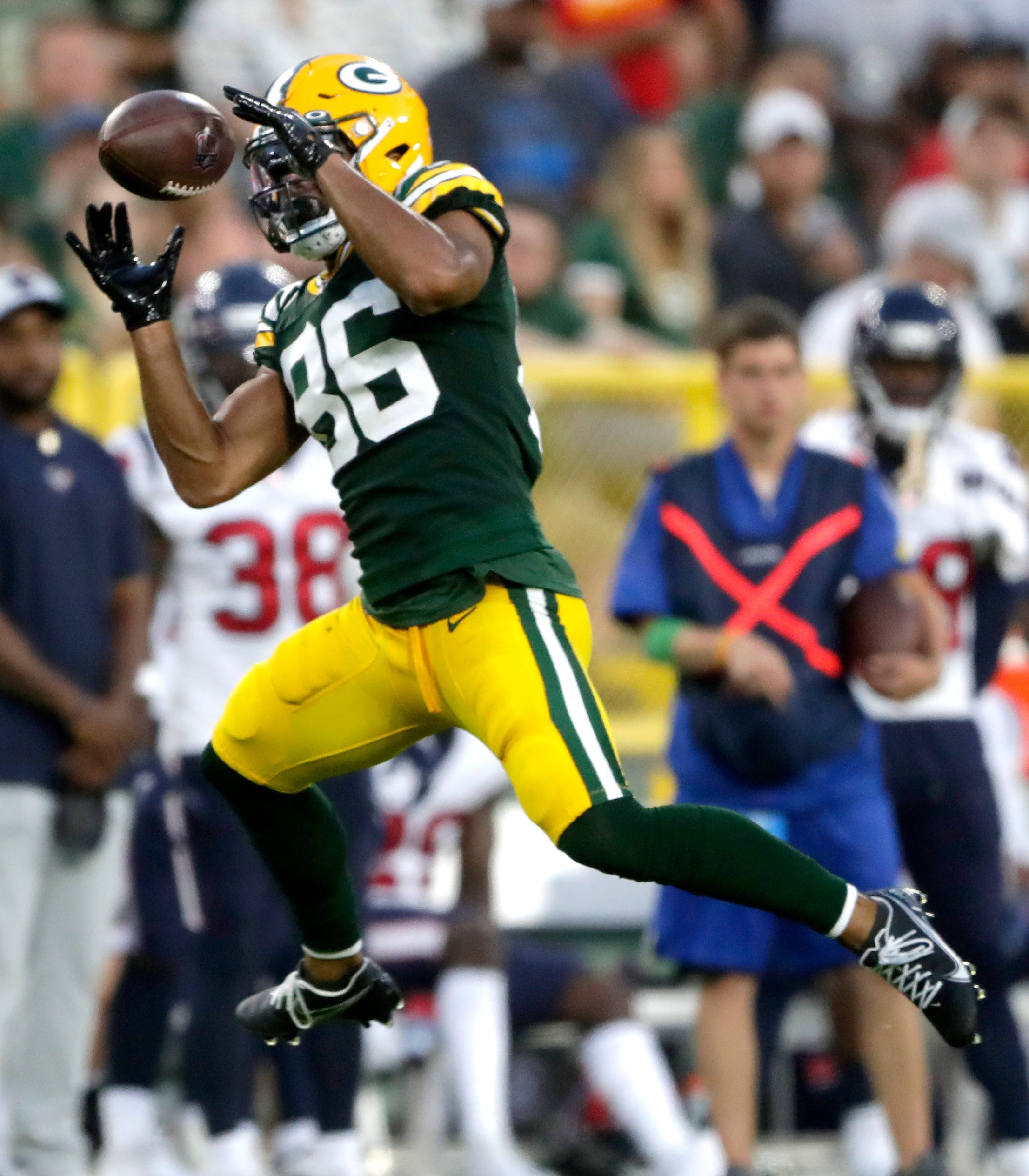 Green Bay Packers wide receiver Malik Taylor (86) makes a catch against the Houston Texans during a preseason game on Saturday, Aug. 14, 2021, at Lambeau Field in Green Bay.