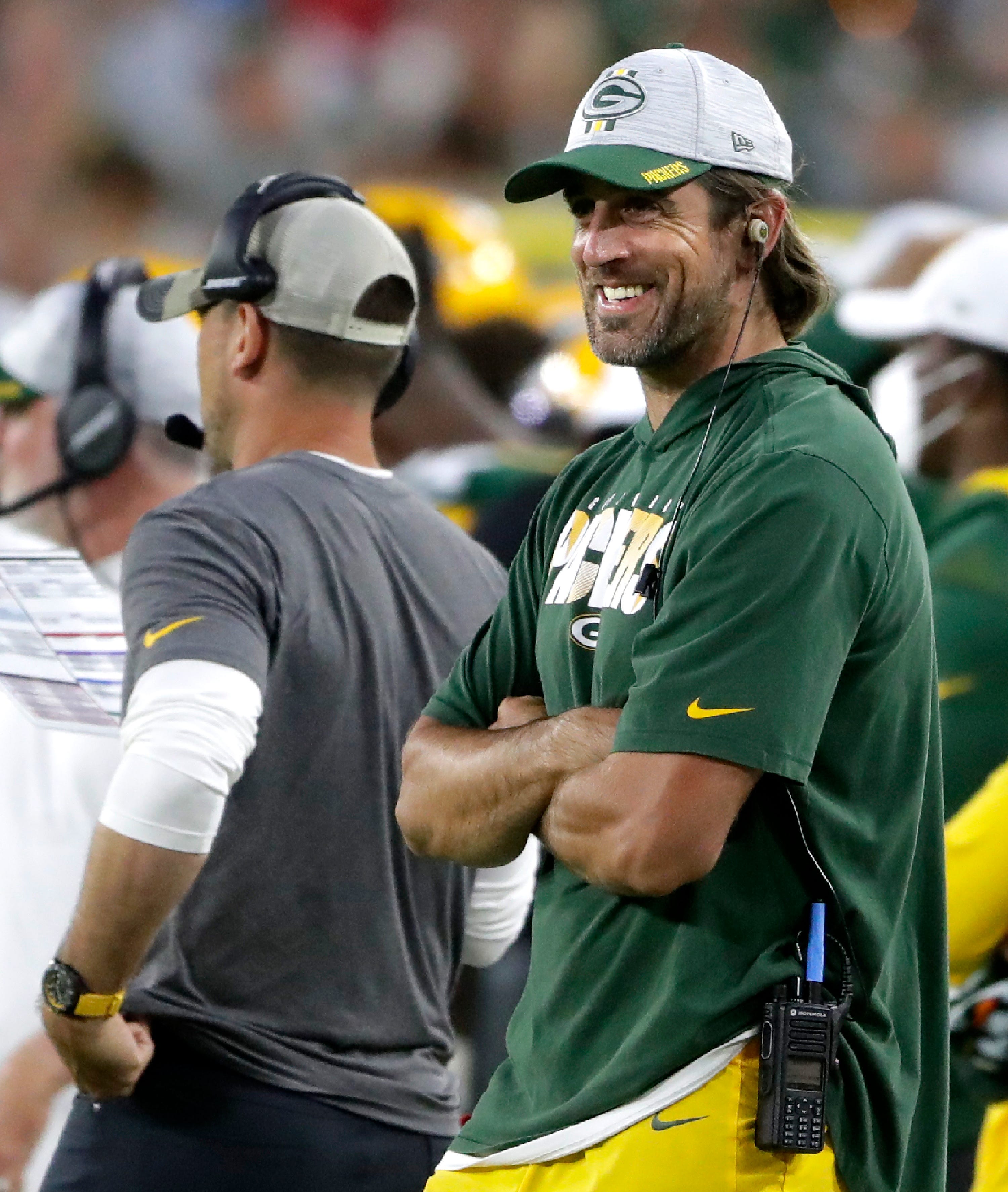 Green Bay Packers quarterback Aaron Rodgers smiles on the sideline against the Houston Texans during a preseason game on Saturday, Aug. 14, 2021, at Lambeau Field in Green Bay.