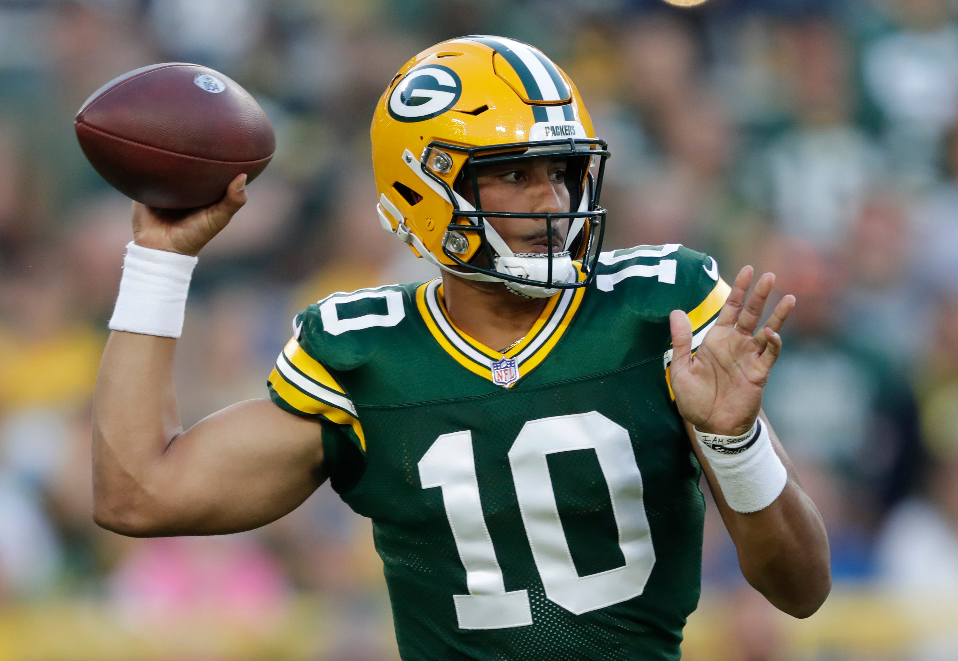 Green Bay Packers quarterback Jordan Love (10) looks to throw in the first quarter in the team's first preseason game against the Houston Texans on Saturday, Aug. 14, 2021, at Lambeau Field in Green Bay.