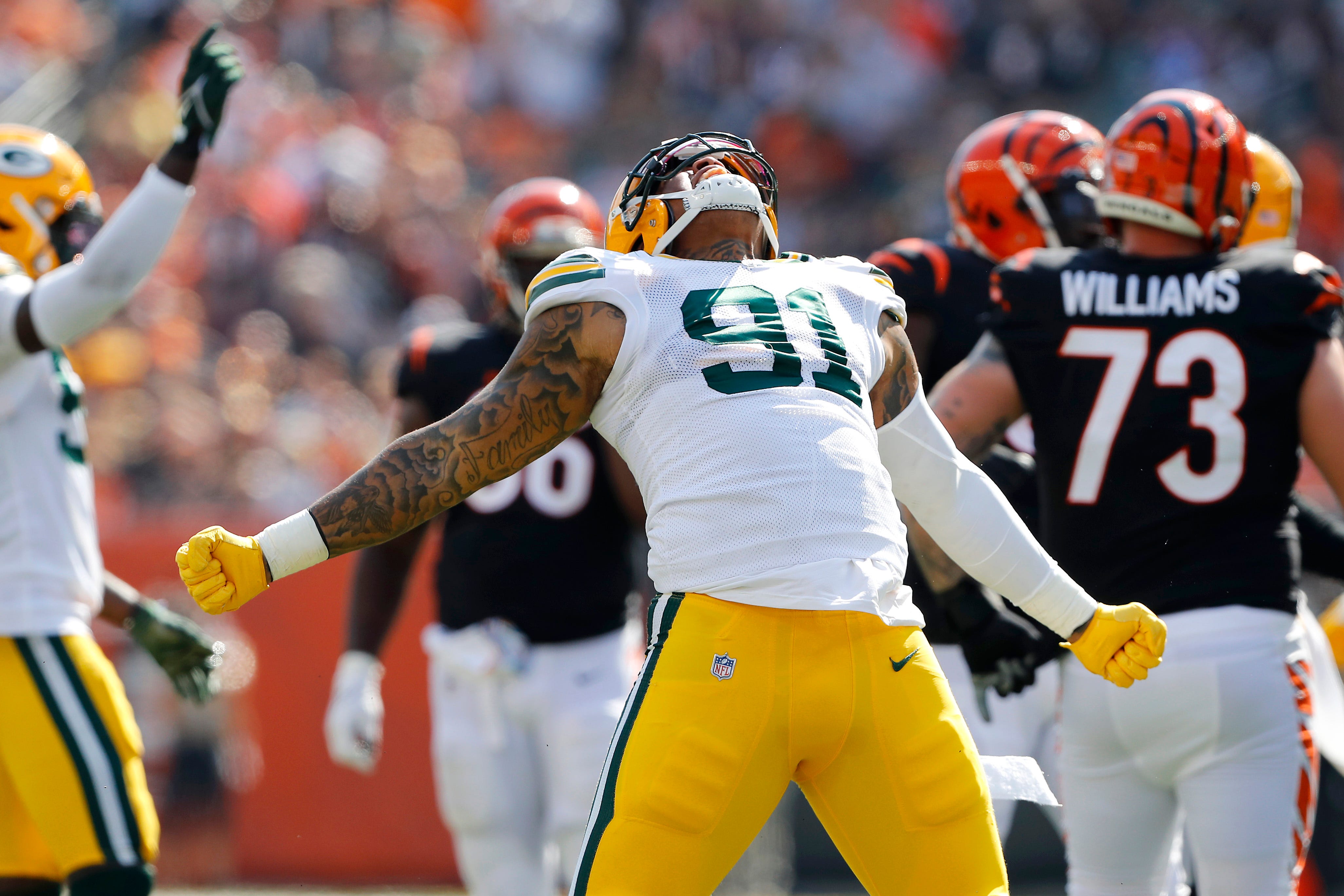 Green Bay Packers outside linebacker Preston Smith (91) celebrates his sack during the second quarter against the Cincinnati Bengals on Oct. 10, 2021, at Paul Brown Stadium.