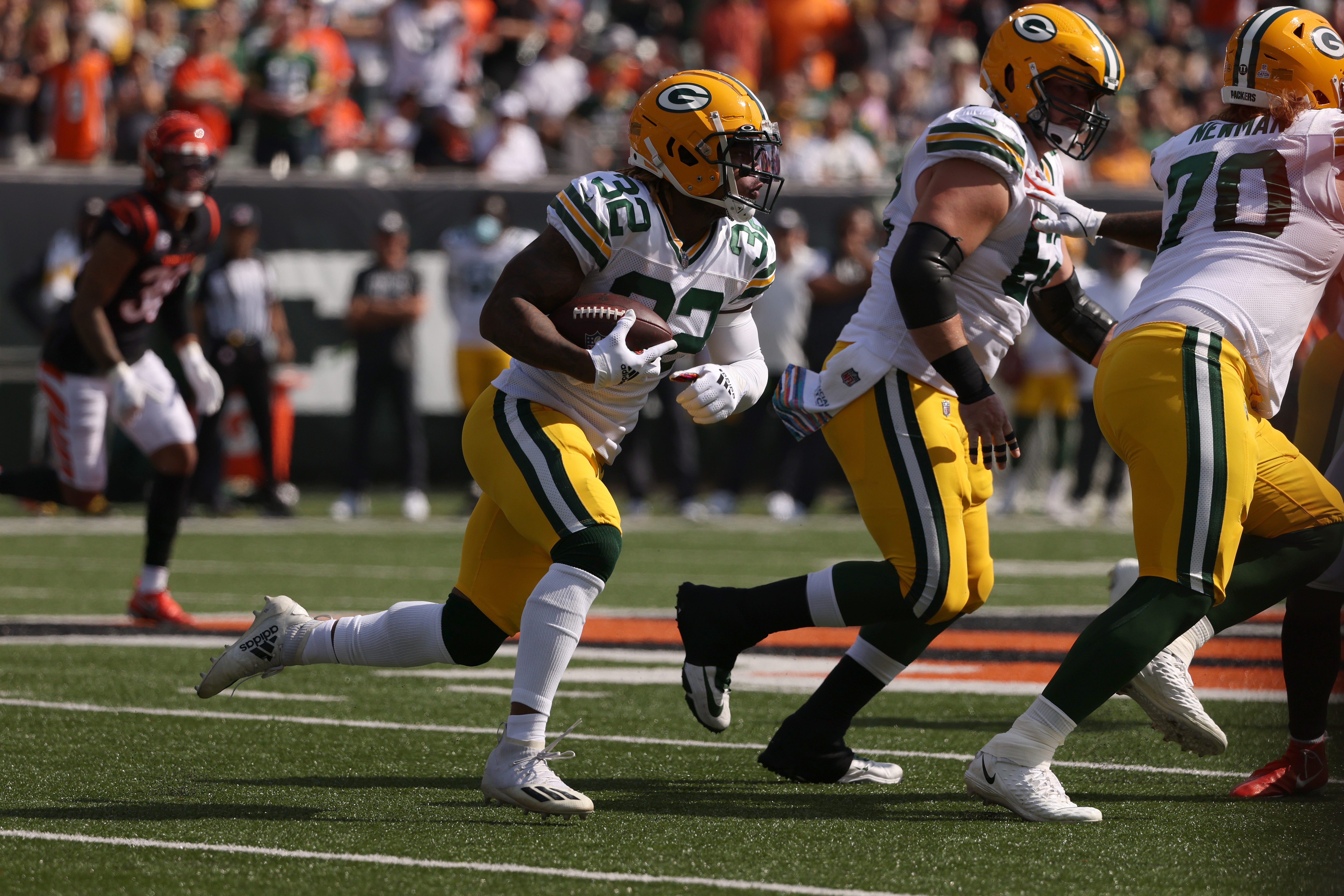 Kylin Hill of the Green Bay Packers looks for running room during the first quarter against the Cincinnati Bengals on Oct. 10, 2021, at Paul Brown Stadium.