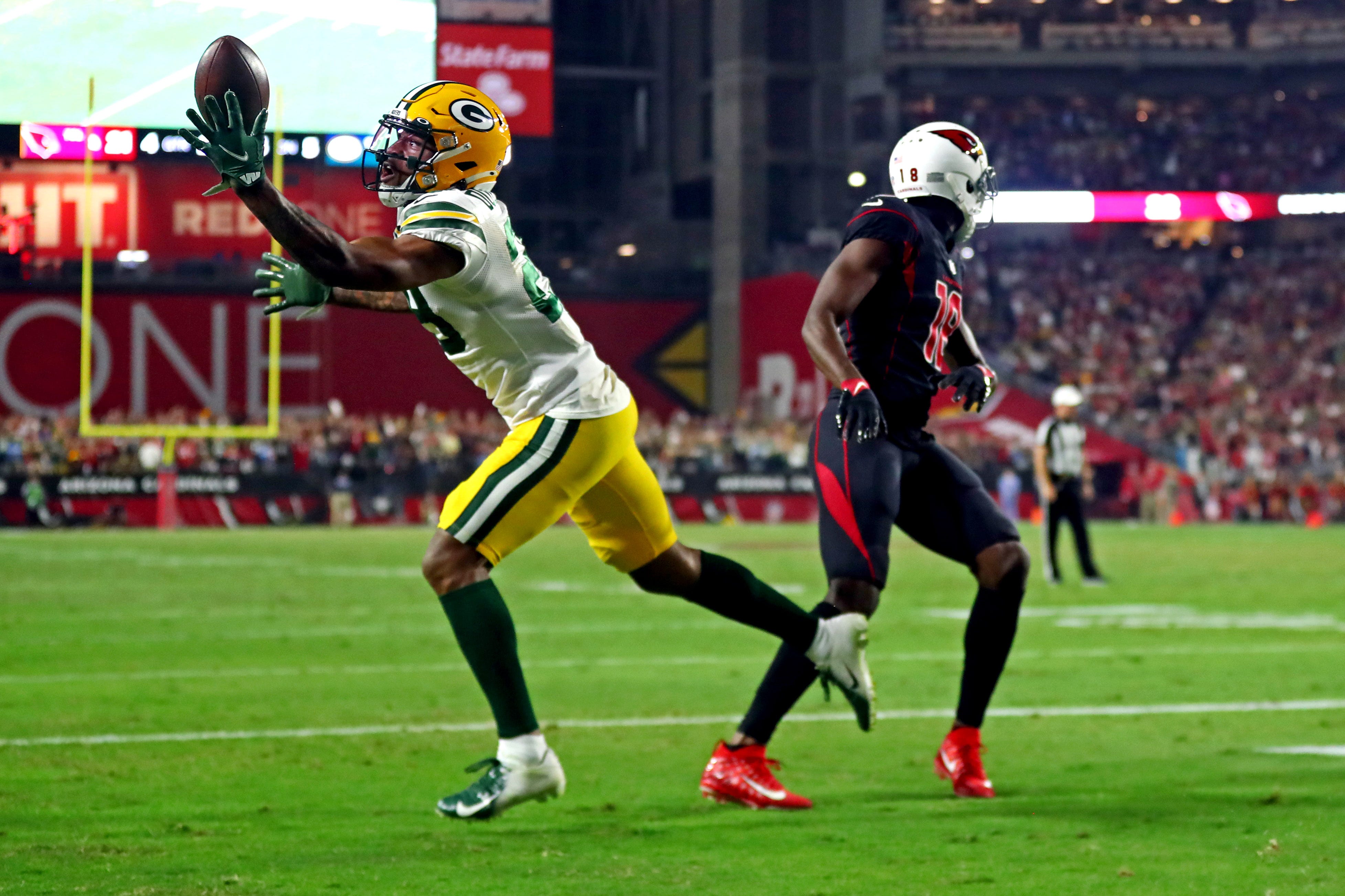 Green Bay Packers cornerback Rasul Douglas (29) makes a game-winning interception on a pass intended for Arizona Cardinals wide receiver Greg Dortch (16) during the fourth quarter on Thursday, Oct. 28, 2021, at State Farm Stadium. The interception sealed the Packers' 24-21 win.