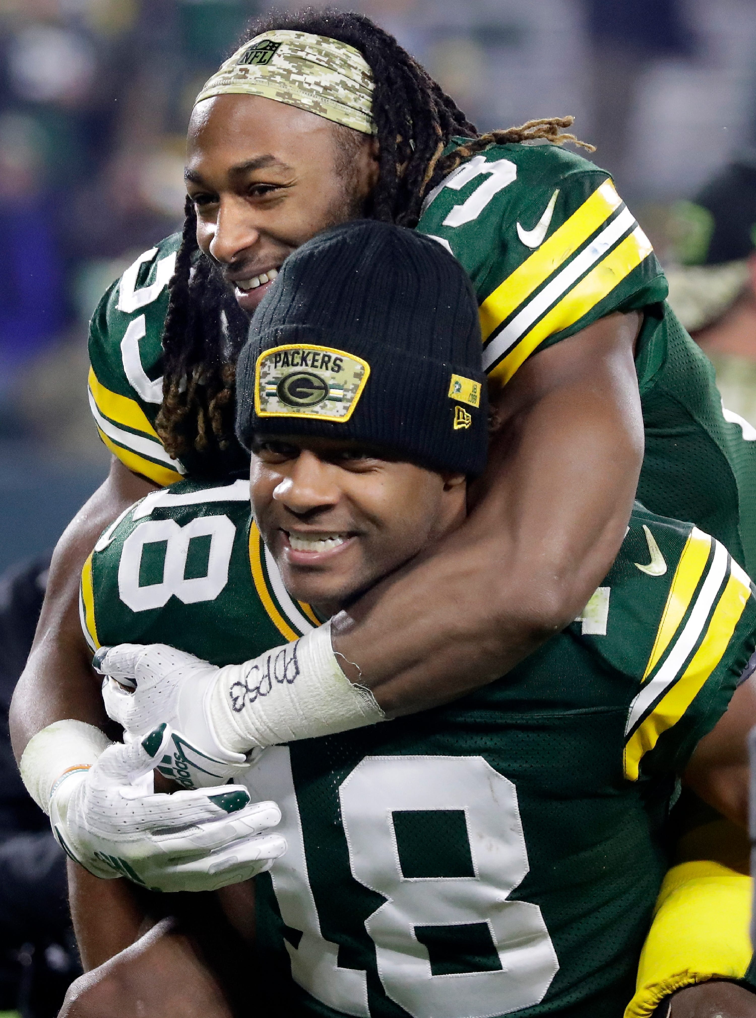 Green Bay Packers wide receiver Randall Cobb (18) and running back Aaron Jones celebrate the 17-0 victory over the Seattle Seahawks on Sunday, Nov. 14, 2021, at Lambeau Field in Green Bay, Wisconsin.