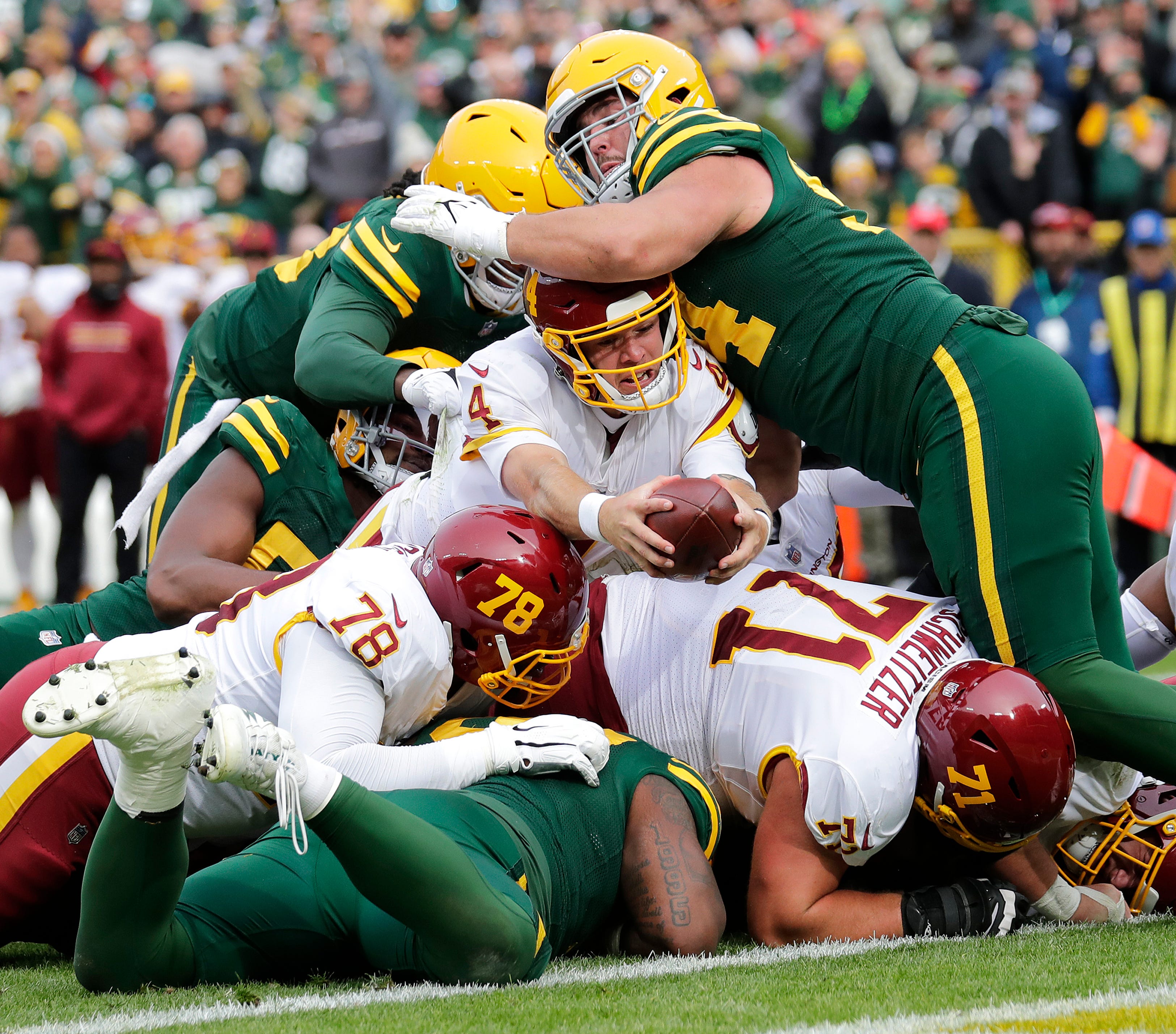 Washington Football Team quarterback Taylor Heinicke (4) comes up short trying to score a touchdown at the goal line in the third quarter against the Green Bay Packers during their football game Sunday, Oct. 24, 2021, at Lambeau Field in Green Bay.