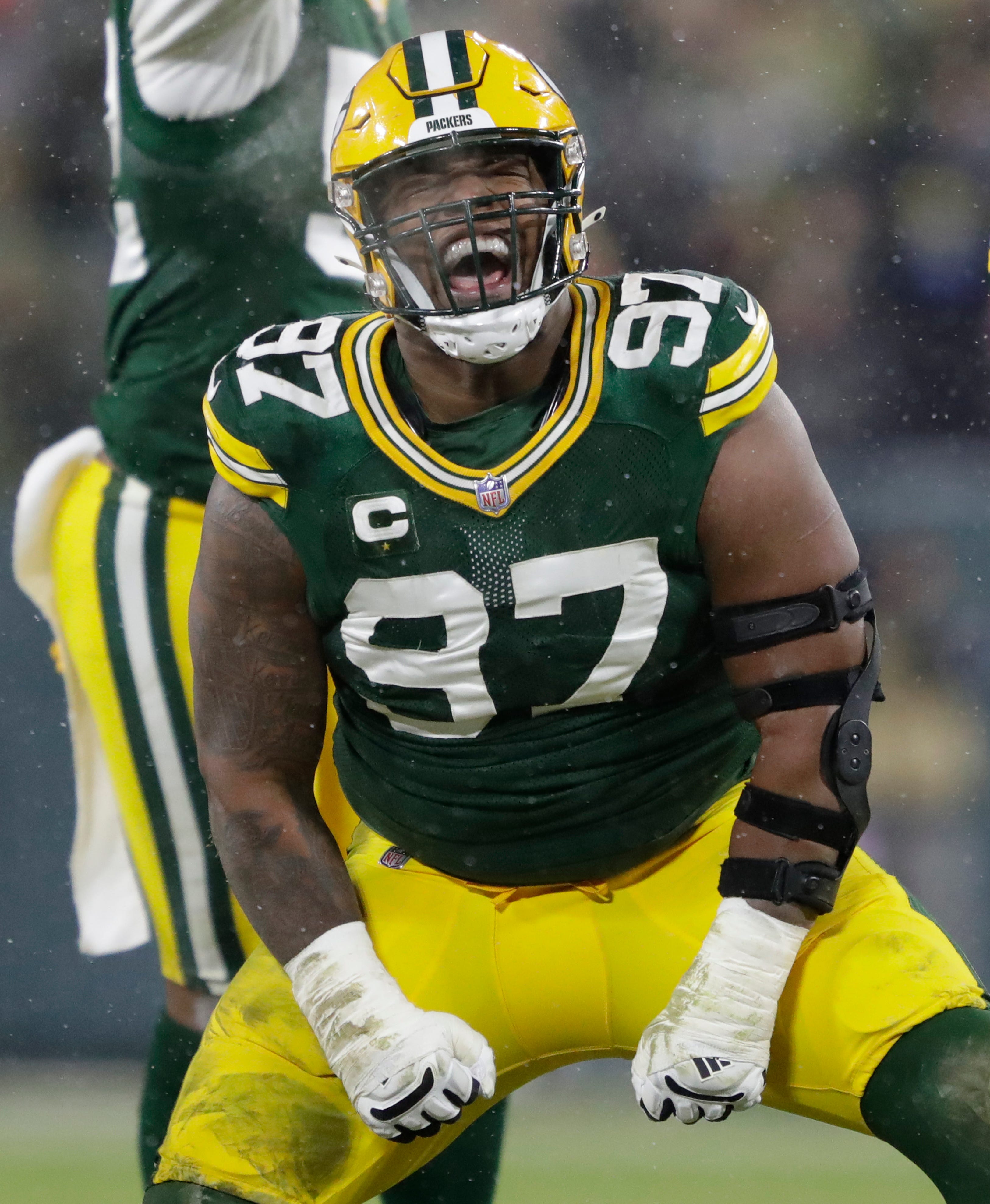 Green Bay Packers nose tackle Kenny Clark (97) celebrates after sacking San Francisco 49ers quarterback Jimmy Garoppolo (10) in the third quarter during their NFL divisional round football playoff game Saturday Jan. 22, 2022, at Lambeau Field in Green Bay.