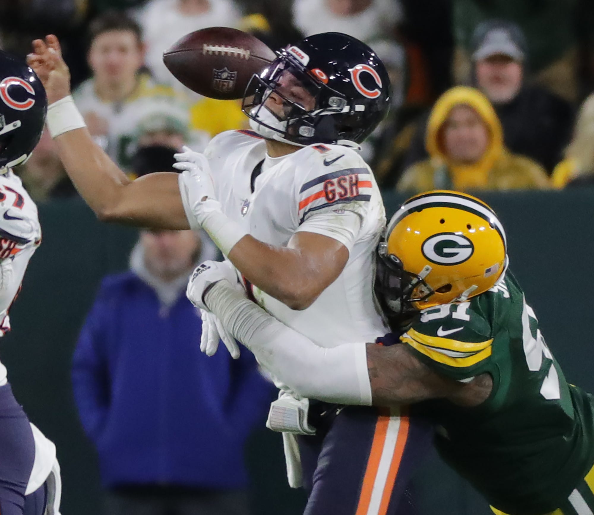 Green Bay Packers linebacker Preston Smith (91) forces a fumble by Chicago Bears quarterback Justin Fields (1) during the third quarter of their game Sunday, December 12, 2021 at Lambeau Field in Green Bay, Wis.