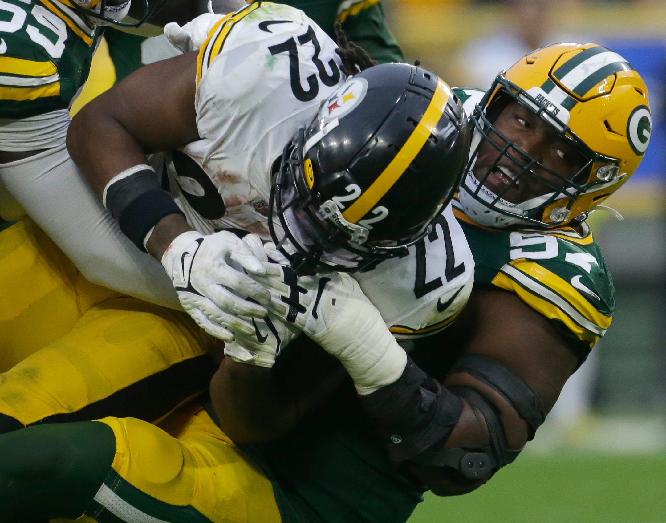Green Bay Packers nose tackle Kenny Clark (97) stuffs Pittsburgh Steelers running back Najee Harris (22)- at the line during the third quarter of their game Sunday, October 3, 2021 at Lambeau Field in Green Bay, Wis. Green Bay Packers beat the Pittsburgh Steelers 27-17.