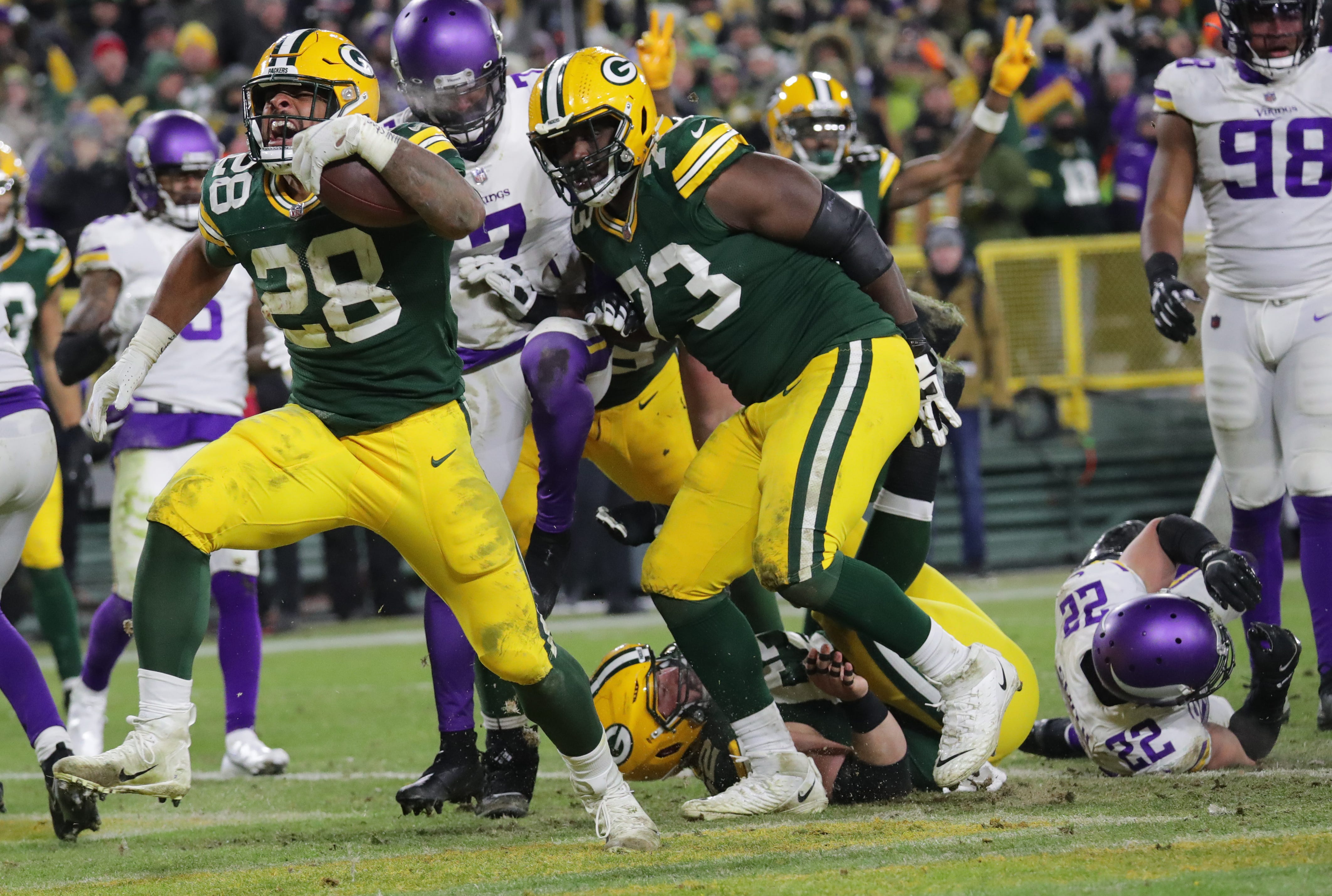 Green Bay Packers running back A.J. Dillon (28) scores touchdown during the the fourth quarter of their game Sunday, January 2, 2022 at Lambeau Field in Green Bay, Wis. The Green Bay Packers beat the Minnesota Vikings 37-10 to clinch a first round playoff bye.
