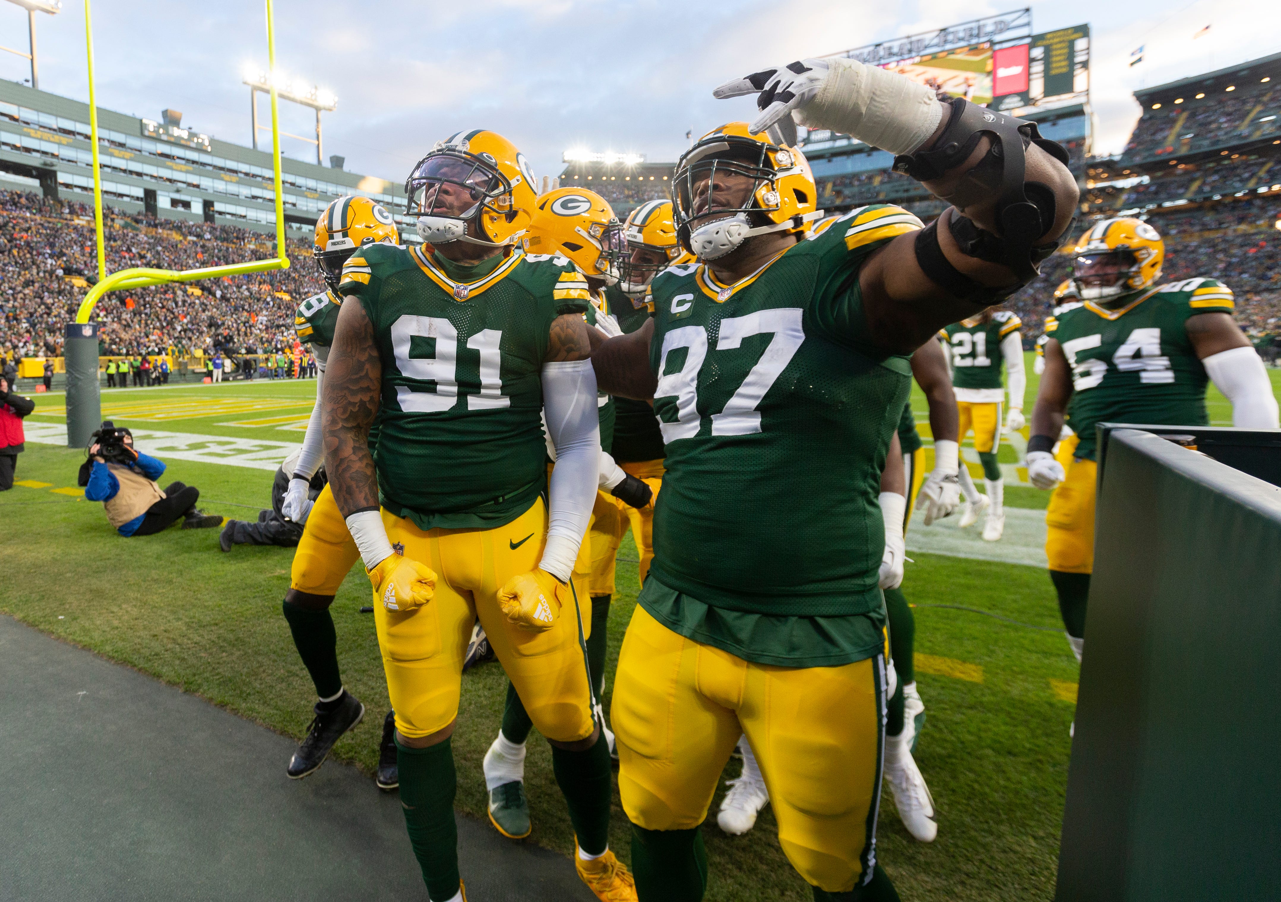 Green Bay Packers outside linebacker Preston Smith (91) celebrates his fumble recovery during the first quarter of their game Sunday, November 28, 2021 at Lambeau Field in Green Bay, Wis.The Green Bay Packers beat the Los Angeles Rams 36-28.