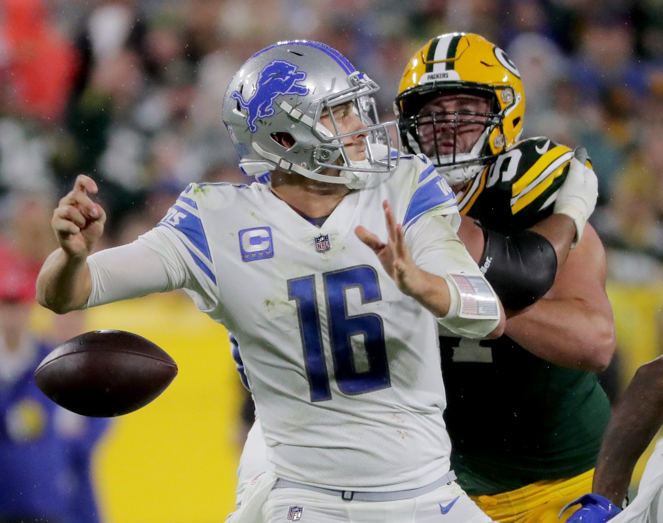 Detroit Lions quarterback Jared Goff fumbles the ball while being pressured by Green Bay Packers defensive end Dean Lowry (94)during the fourth quarter of their game Monday, September 20, 2021 at Lambeau Field in Green Bay, Wis. The Lions recovered the ball. The Green Bay Packers beat the Detroit Lions 35-17.