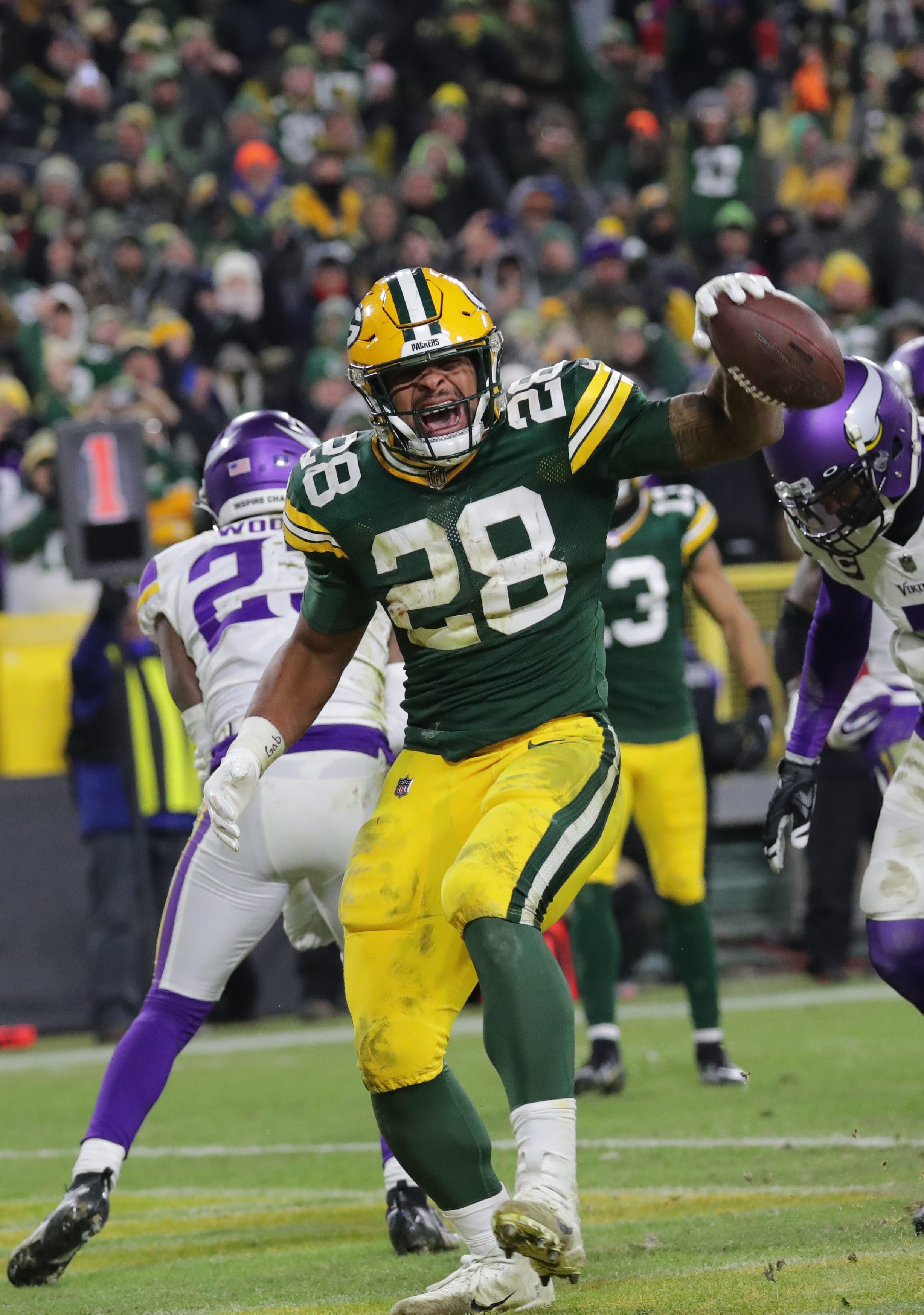 Green Bay Packers running back A.J. Dillon (28) scores touchdown during the the fourth quarter of their game Sunday, January 2, 2022 at Lambeau Field in Green Bay, Wis. The Green Bay Packers beat the Minnesota Vikings 37-10 to clinch a first round playoff bye.