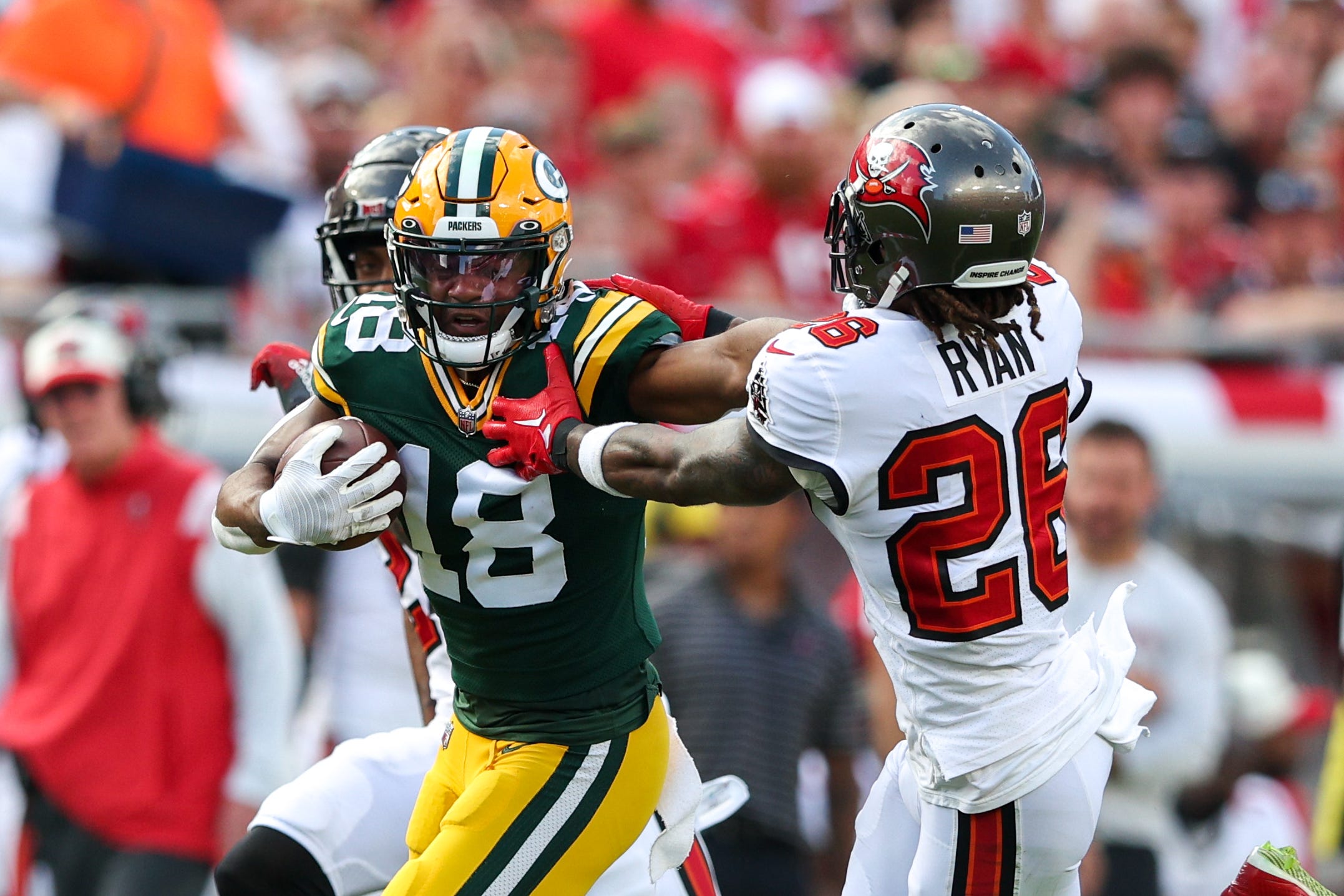 Green Bay Packers wide receiver Randall Cobb (18) stiff arms Tampa Bay Buccaneers safety Logan Ryan (26) in the second quarter at Raymond James Stadium.