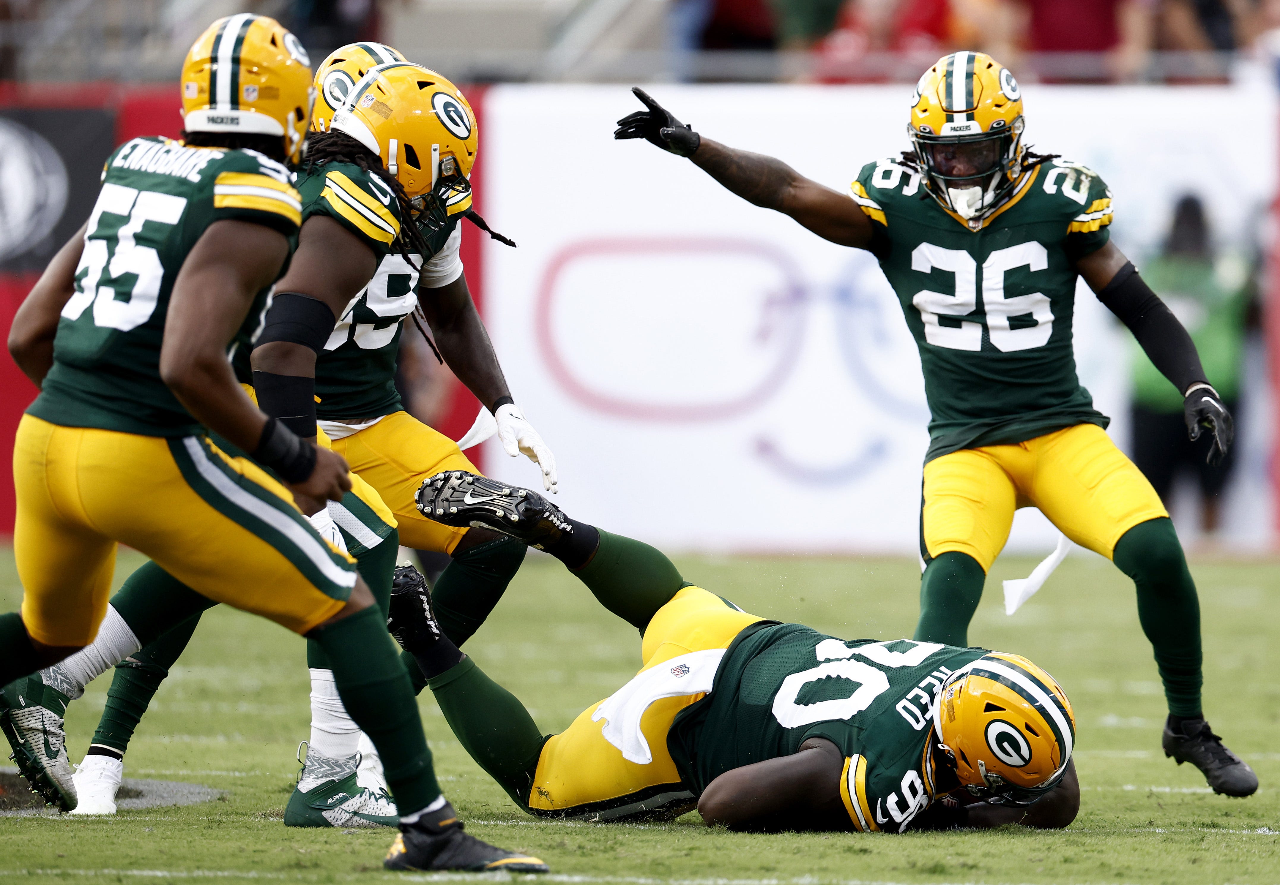 Jarran Reed (90) of the Green Bay Packers recovers a fumble against the Tampa Bay Buccaneers during the third quarter on Sept. 25, 2022, at Raymond James Stadium in Tampa, Florida.