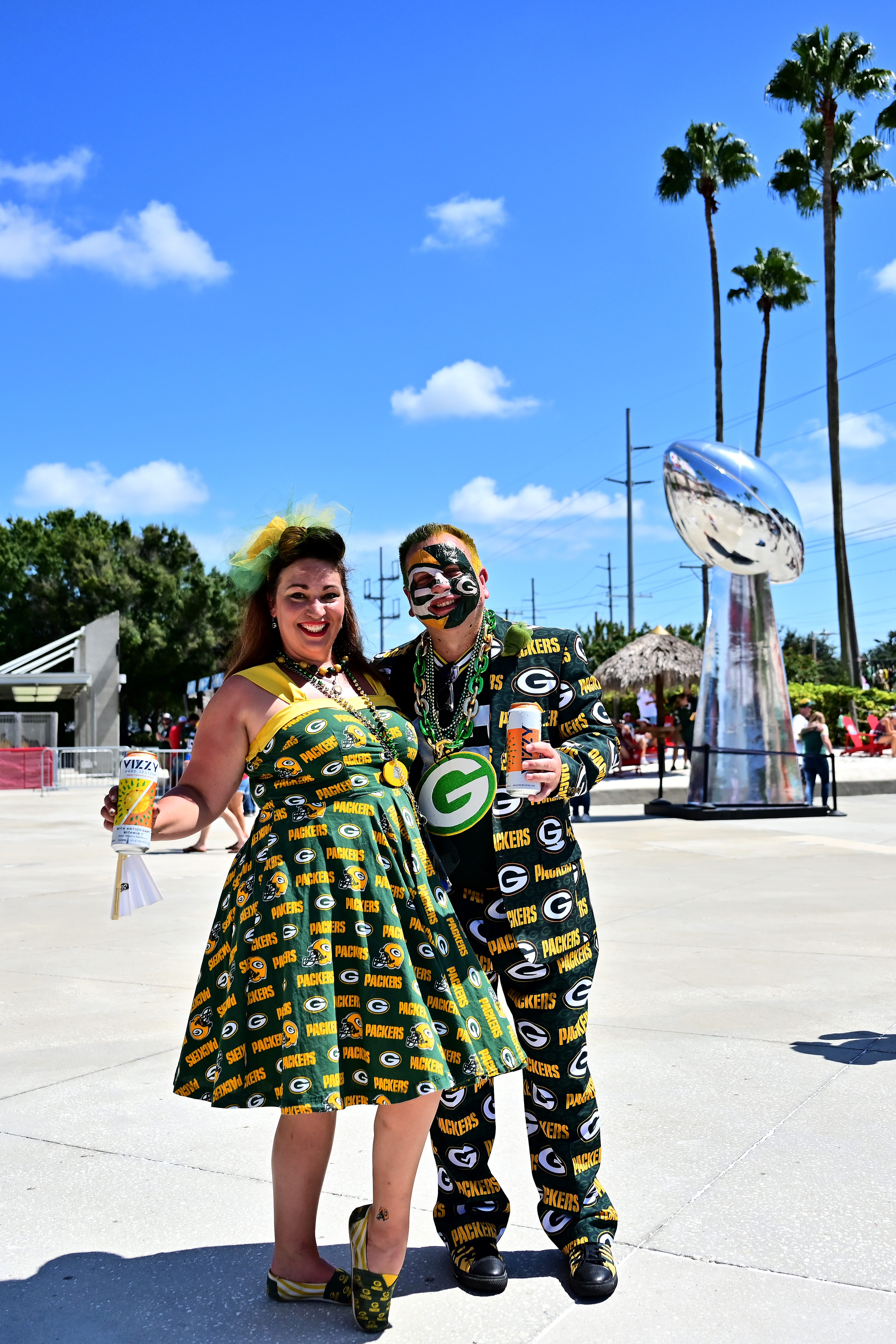 Green Bay Packers fans pose outside of Raymond James Stadium prior to the Packers' game against the Tampa Bay Buccaneers on Sept. 25, 2022 in Tampa, Florida.