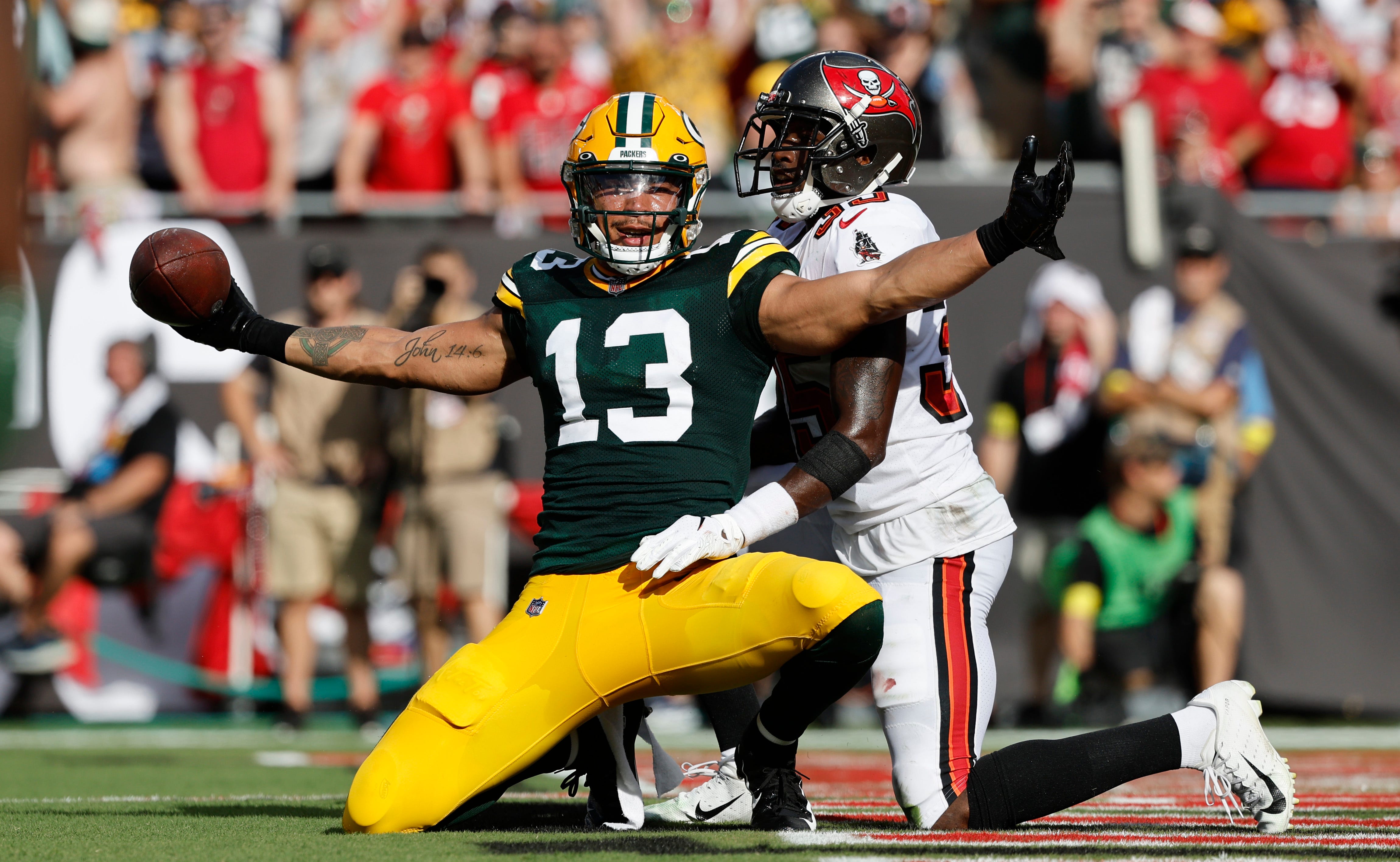 Green Bay Packers wide receiver Allen Lazard (13) celebrates after scoring a touchdown  against the Tampa Bay Buccaneers.