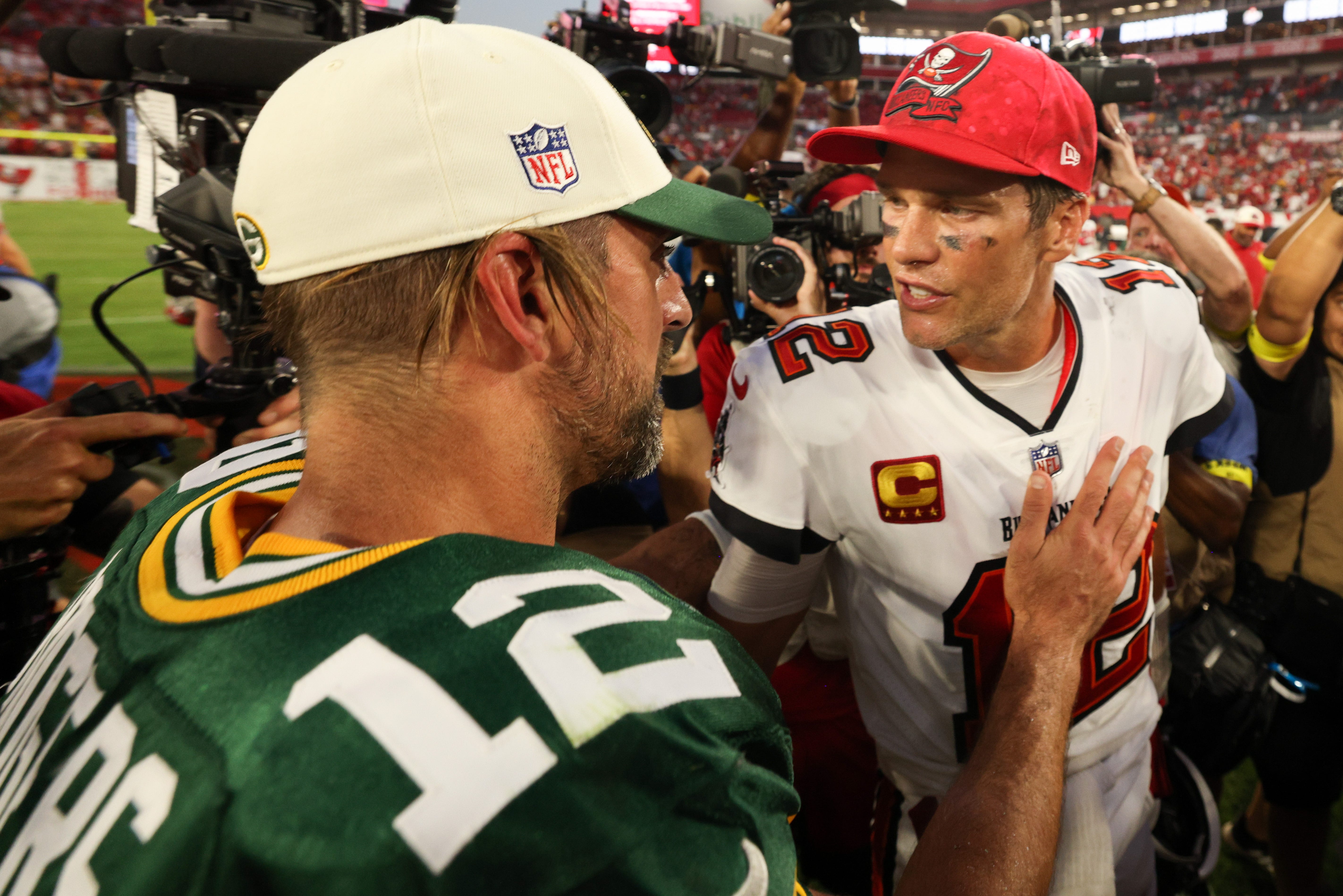Tampa Bay Buccaneers quarterback Tom Brady and Green Bay Packers quarterback Aaron Rodgers greet each other after the Packers defeated the Buccaneers, 14-12, on Sept. 25, 2022, at Raymond James Stadium.