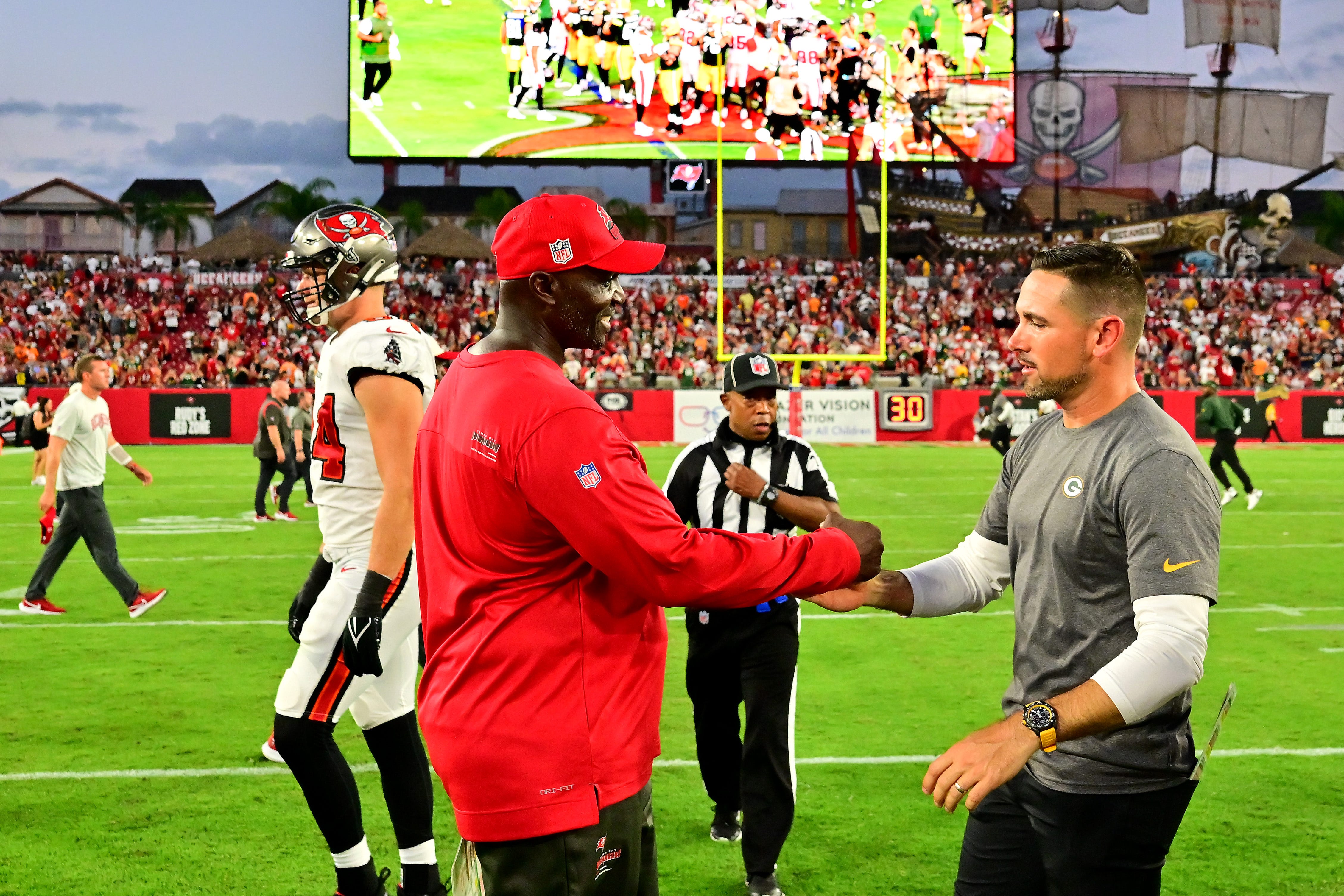 Head coach Todd Bowles of the Tampa Bay Buccaneers shakes hands with head coach Matt LaFleur of the Green Bay Packers after the game on Sept. 25, 2022, at Raymond James Stadium in Tampa, Florida. The Packers defeated the Buccaneers, 14-12.